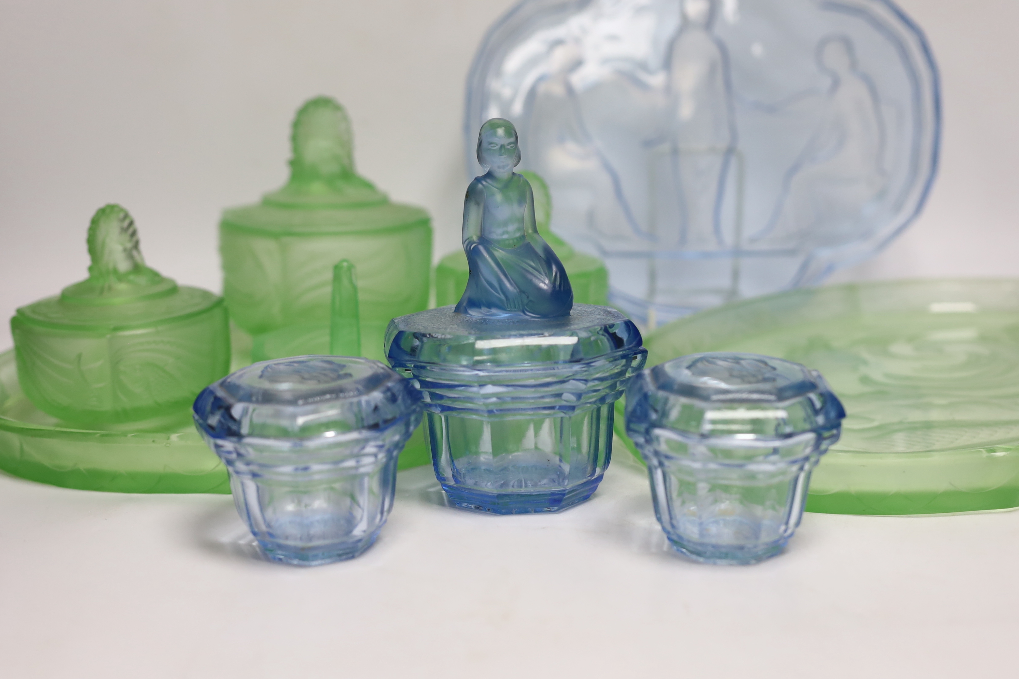 Walther & Sohne, moulded glass dressing table sets including three trays, lidded jars, etc., largest tray 35.5cm